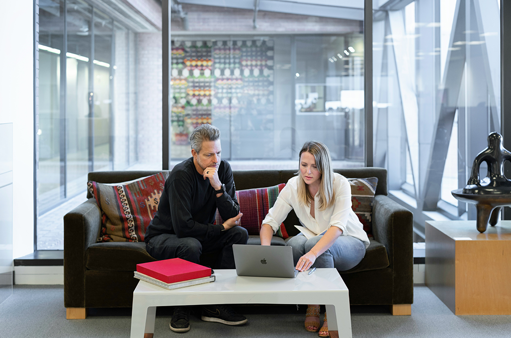 Two people discussing financial strategy.