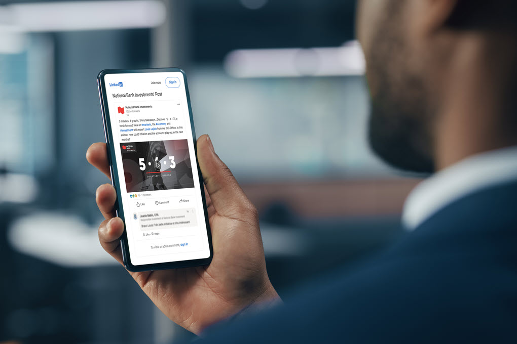 financial advisor using the LinkedIn application on his mobile phone