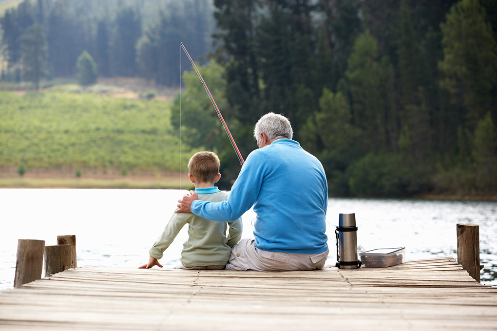 Grandfather and grandson go fishing.