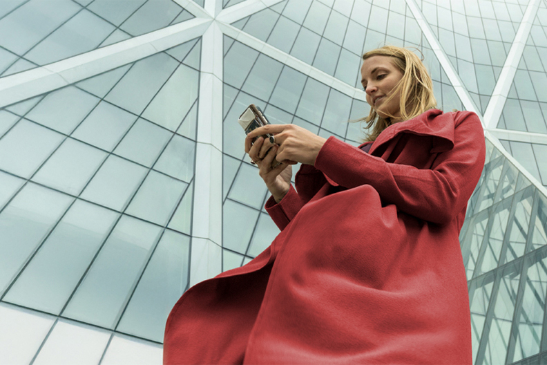 Woman looks at her phone